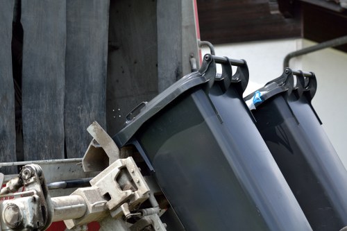 Workers responsibly disposing of various furniture items