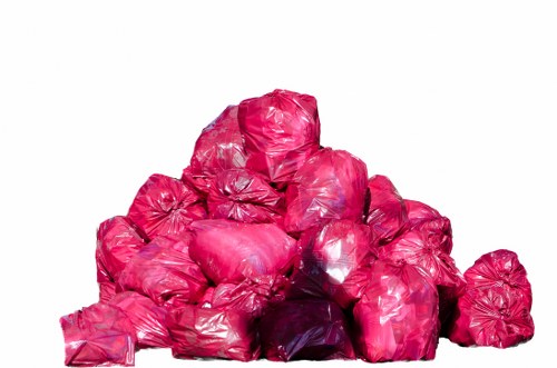 Professional waste disposal team handling furniture