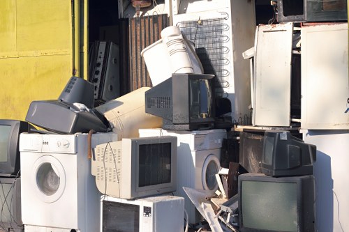 Professional trash collection team removing furniture